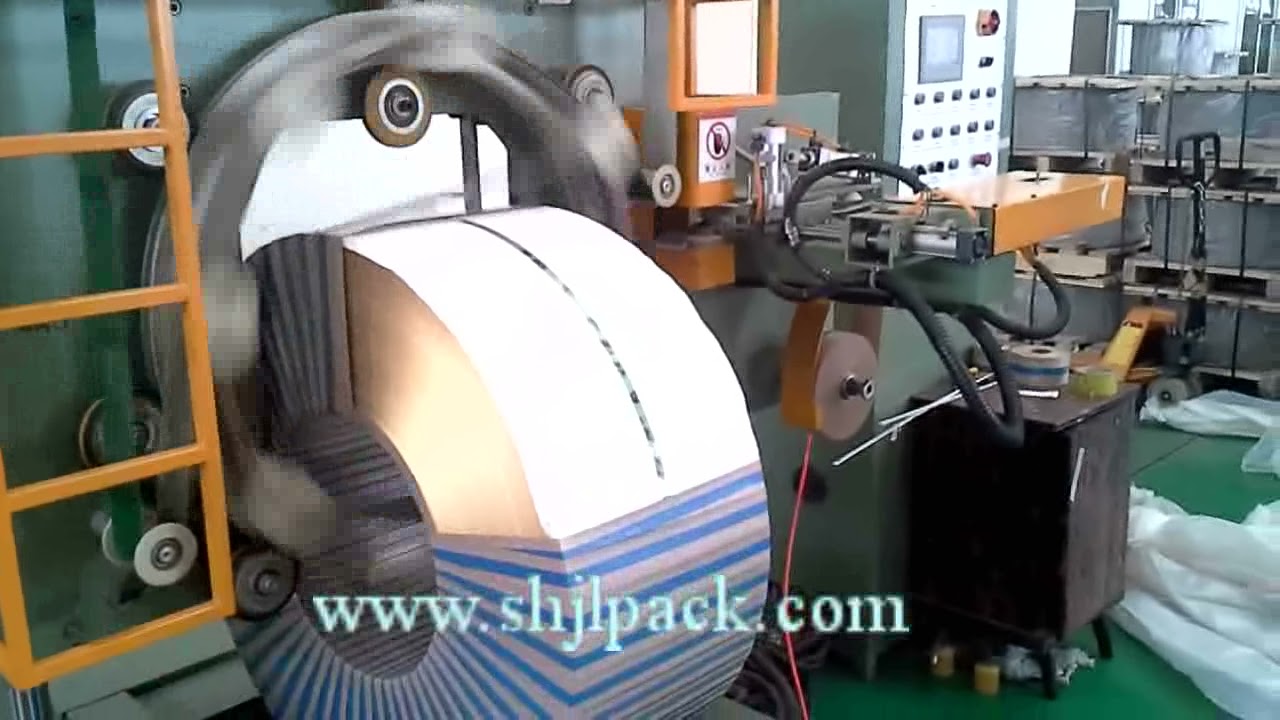 Compact Machine For Packing Coils And Wrapping Steel Materials Strappack